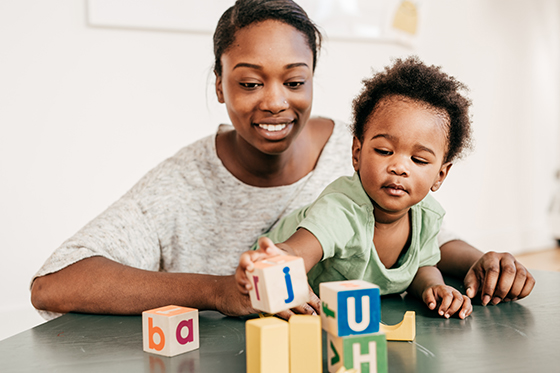 Image of mother and son playing with blocks