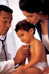 Doctor examining child with stethoscope