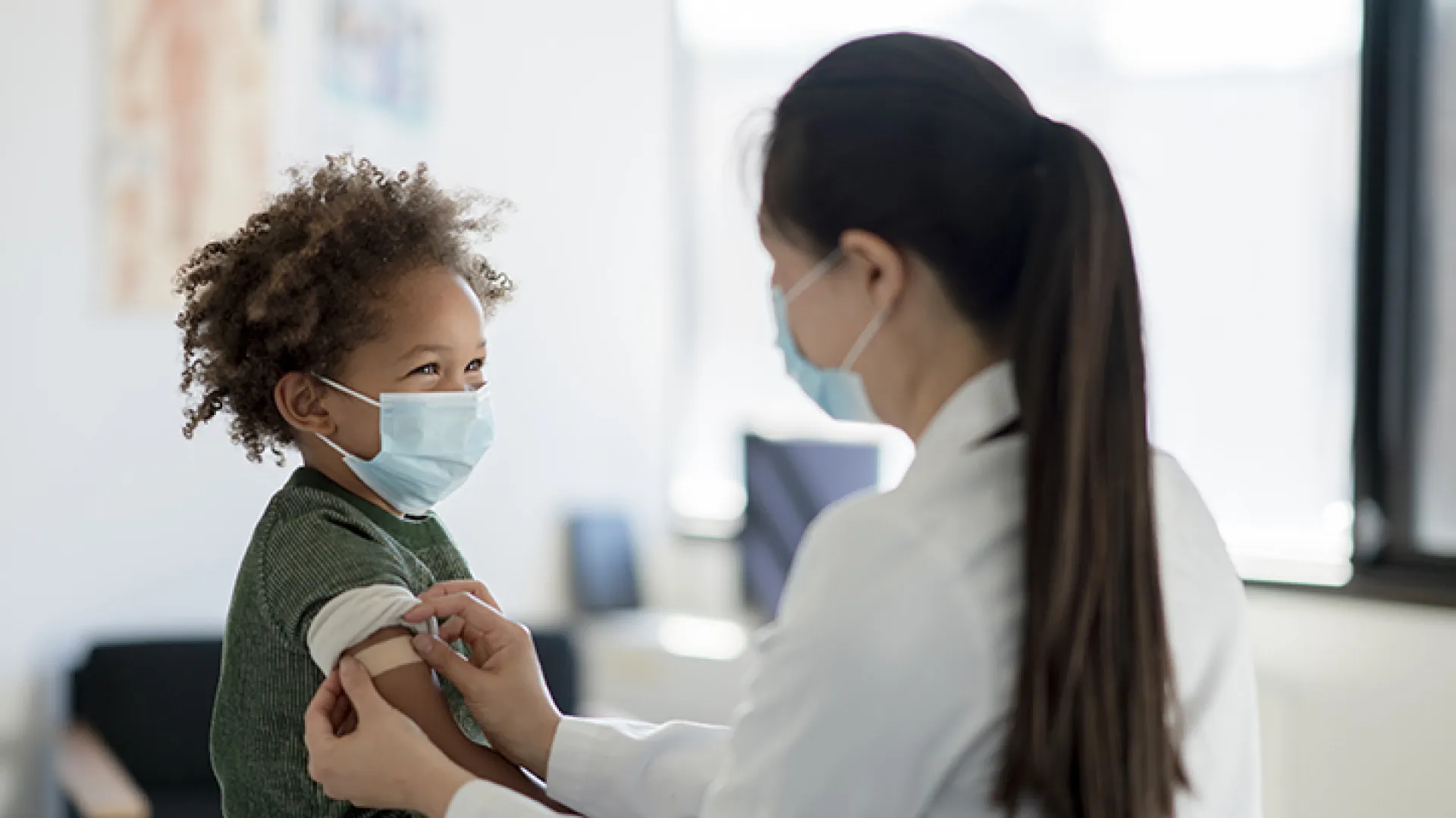 Doctor and smiling child patient