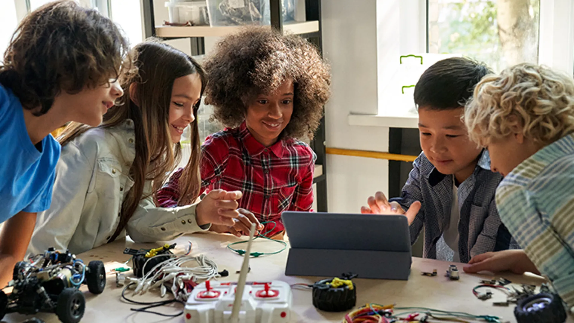 Middle school kids working on an engineering project
