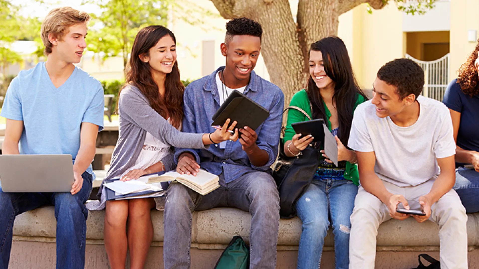 Diverse group of teenage students outside
