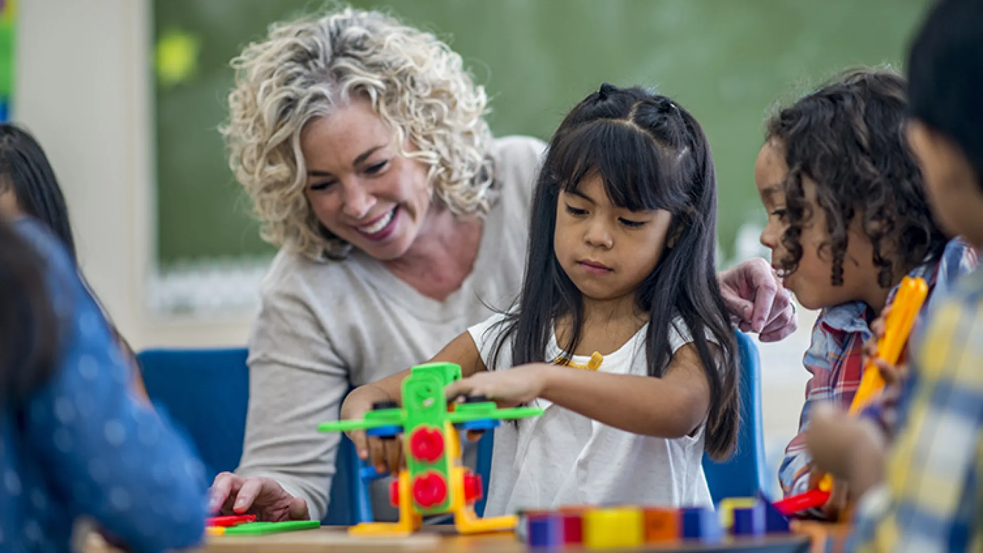 Early childhood teacher and students