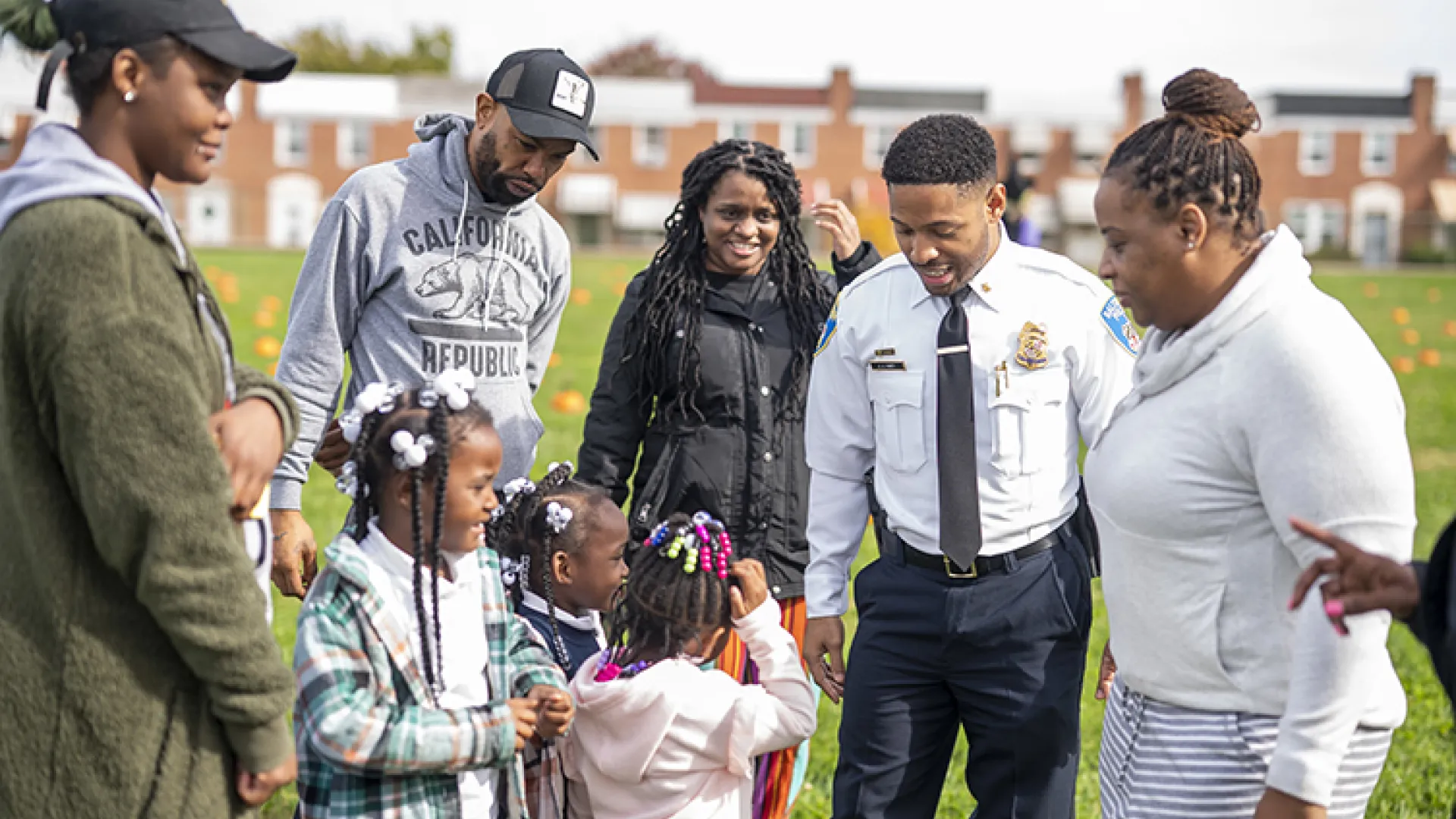 Baltimore police officer with community members