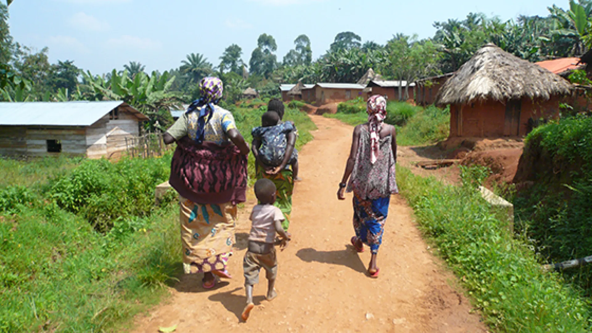 Women in DRC walking to a community meeting