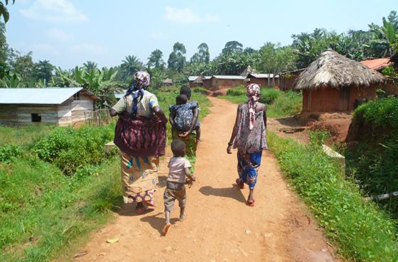 Women in DRC walking to a community meeting