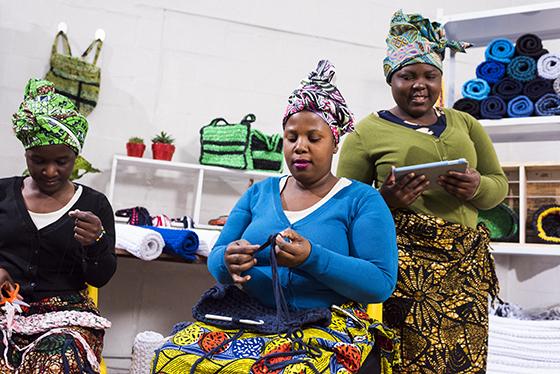 African women knitting and working together
