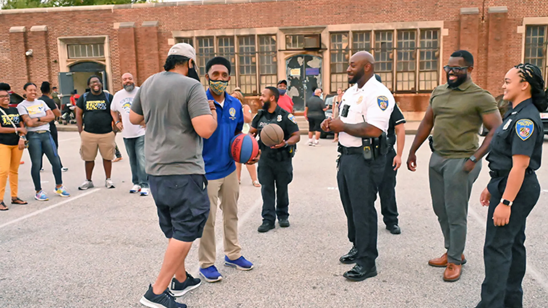 Baltimore police playing basketball with community members