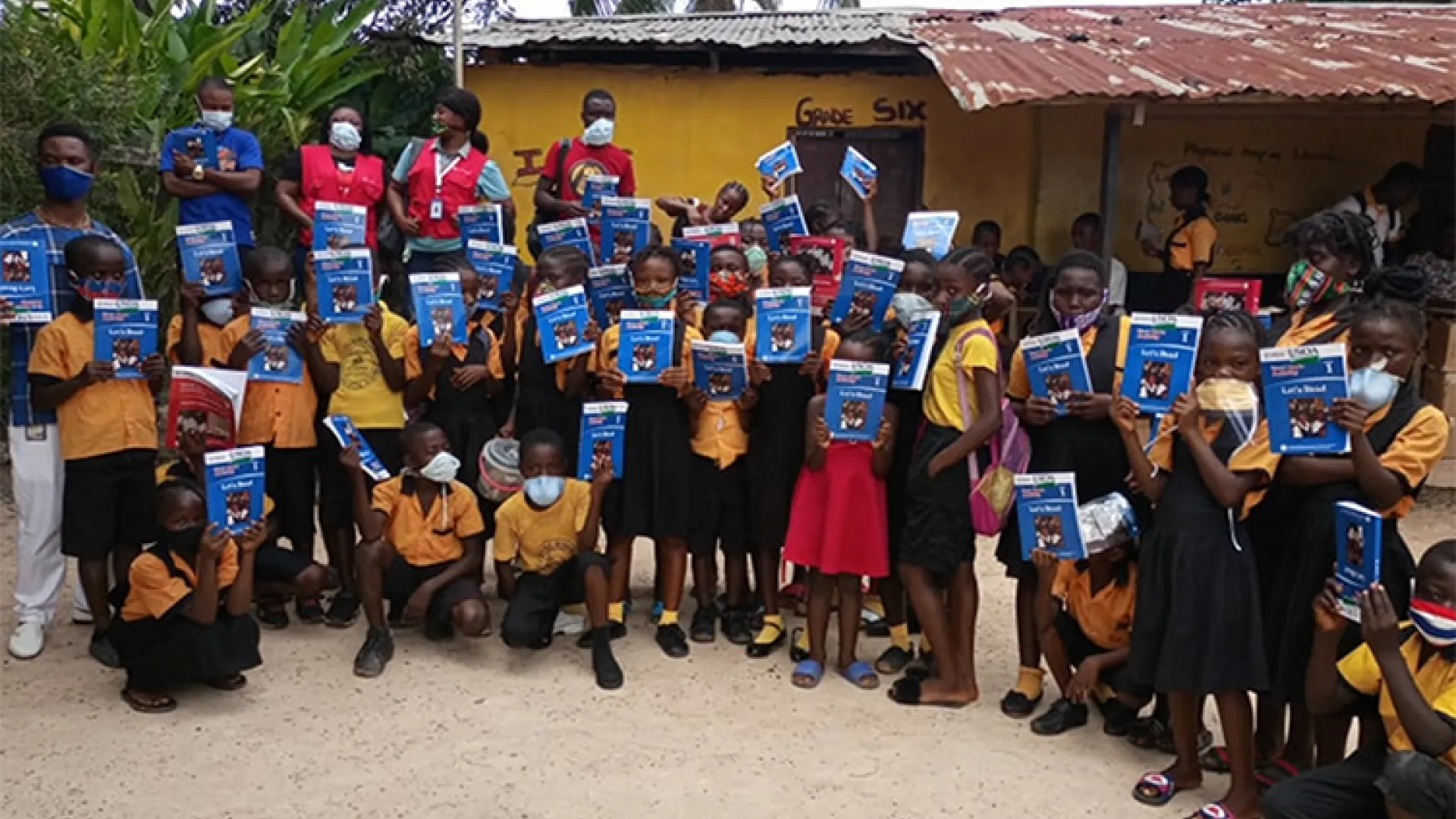 Children in Liberia receive books from Let's Read book distribution