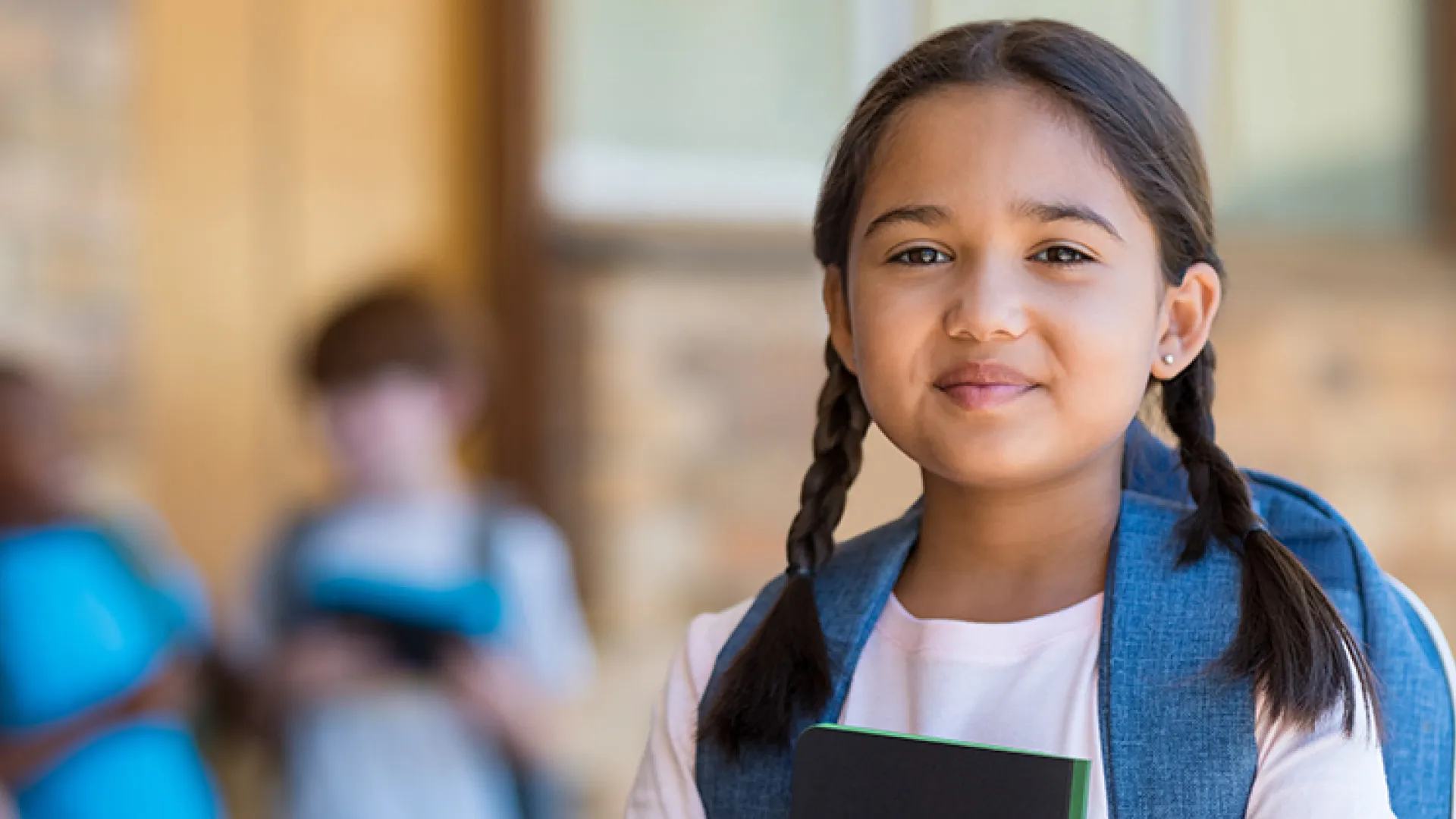 Girl with backpack smiling