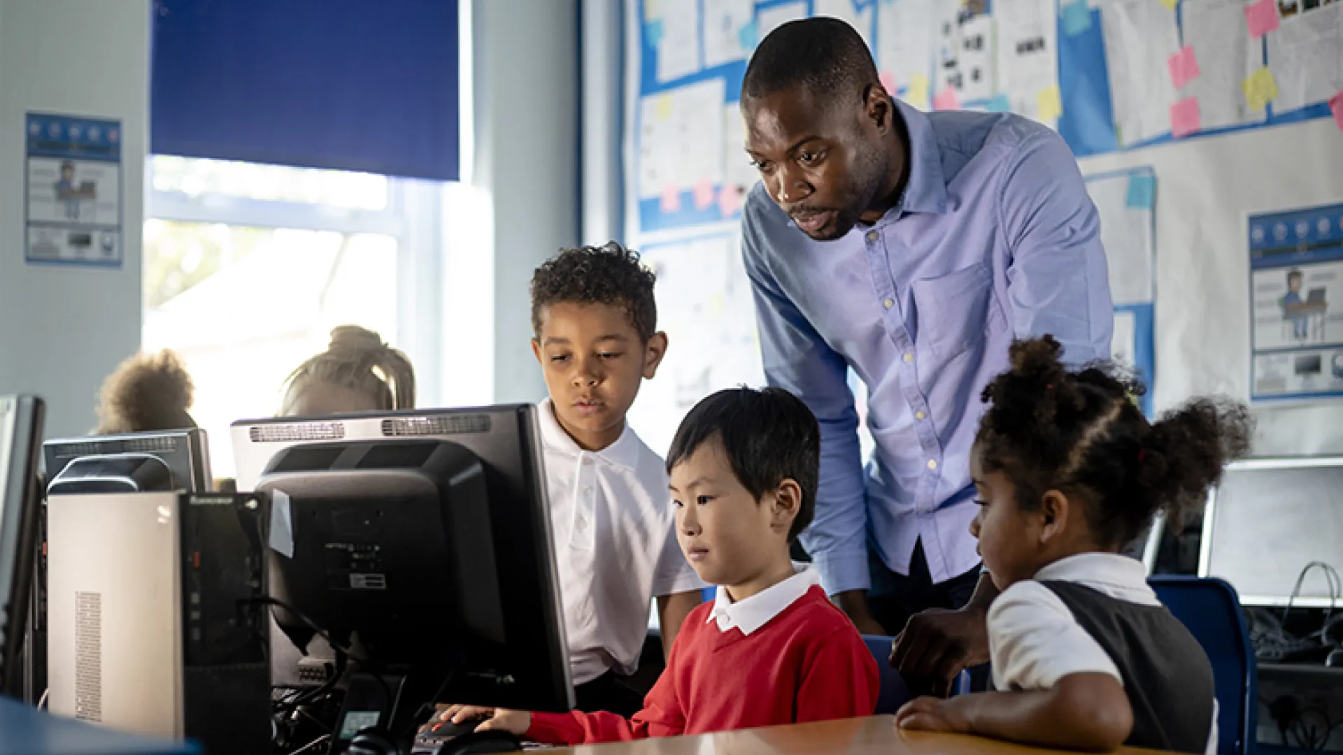 Computer science teacher with young students