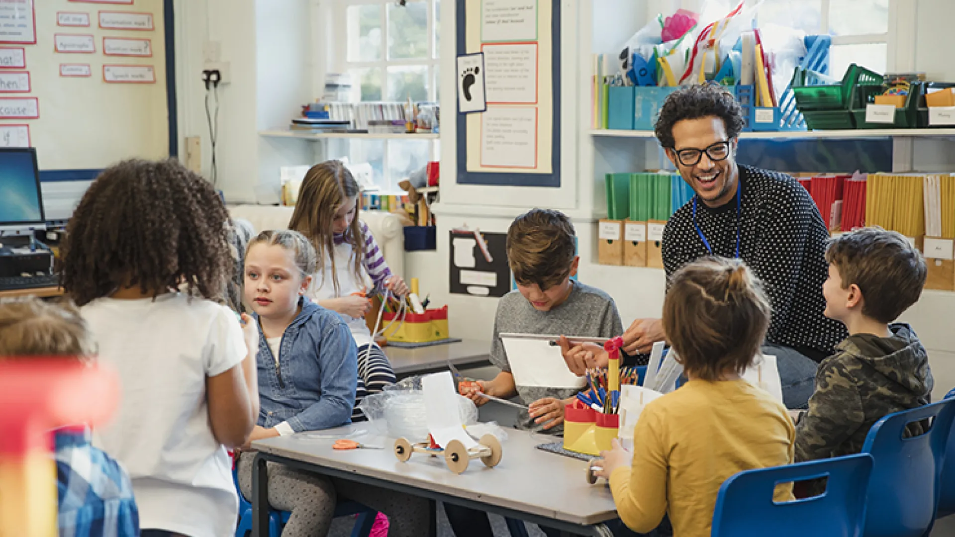 Teacher and young students in classroom