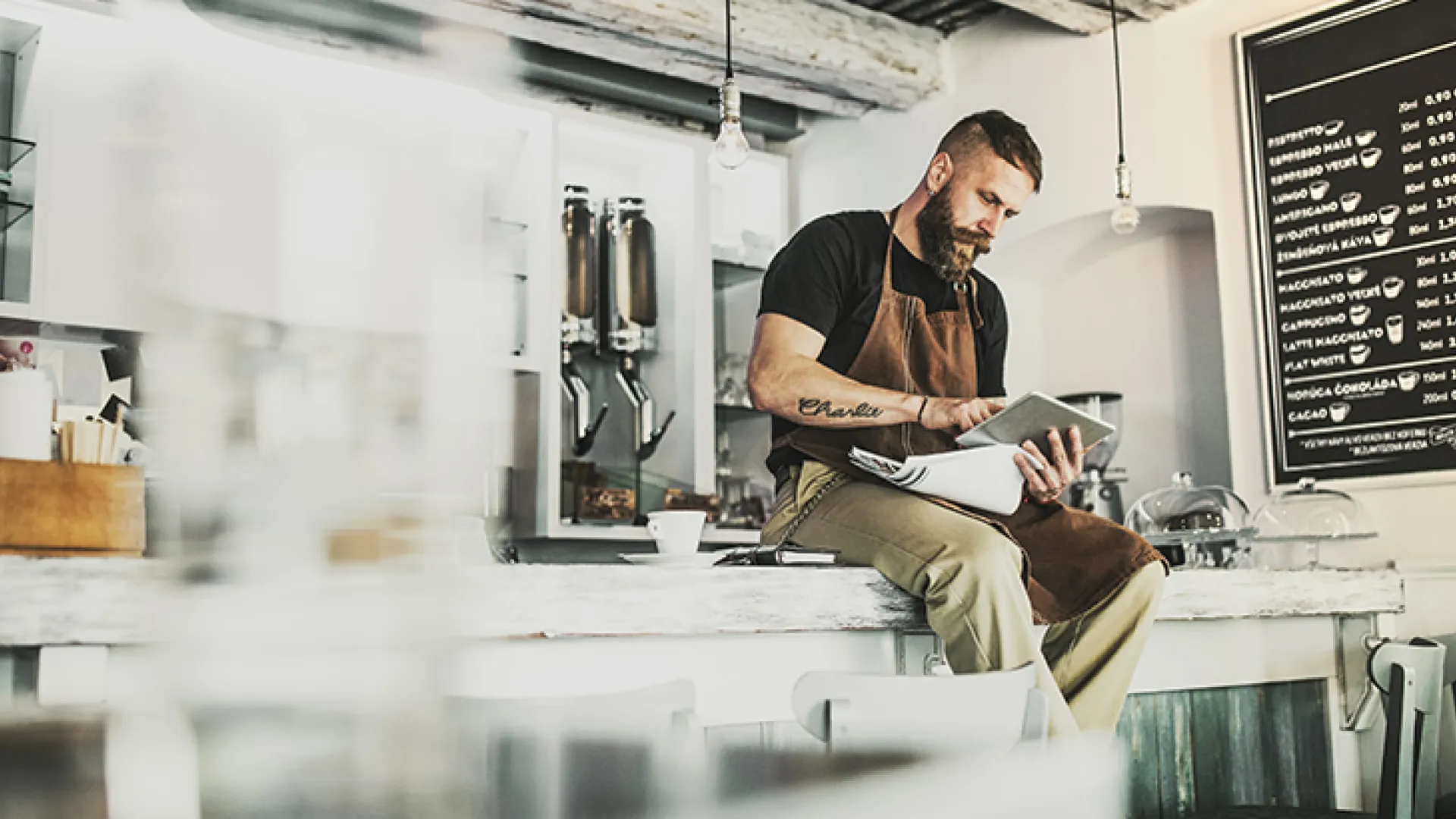 Bearded barista deep in thought