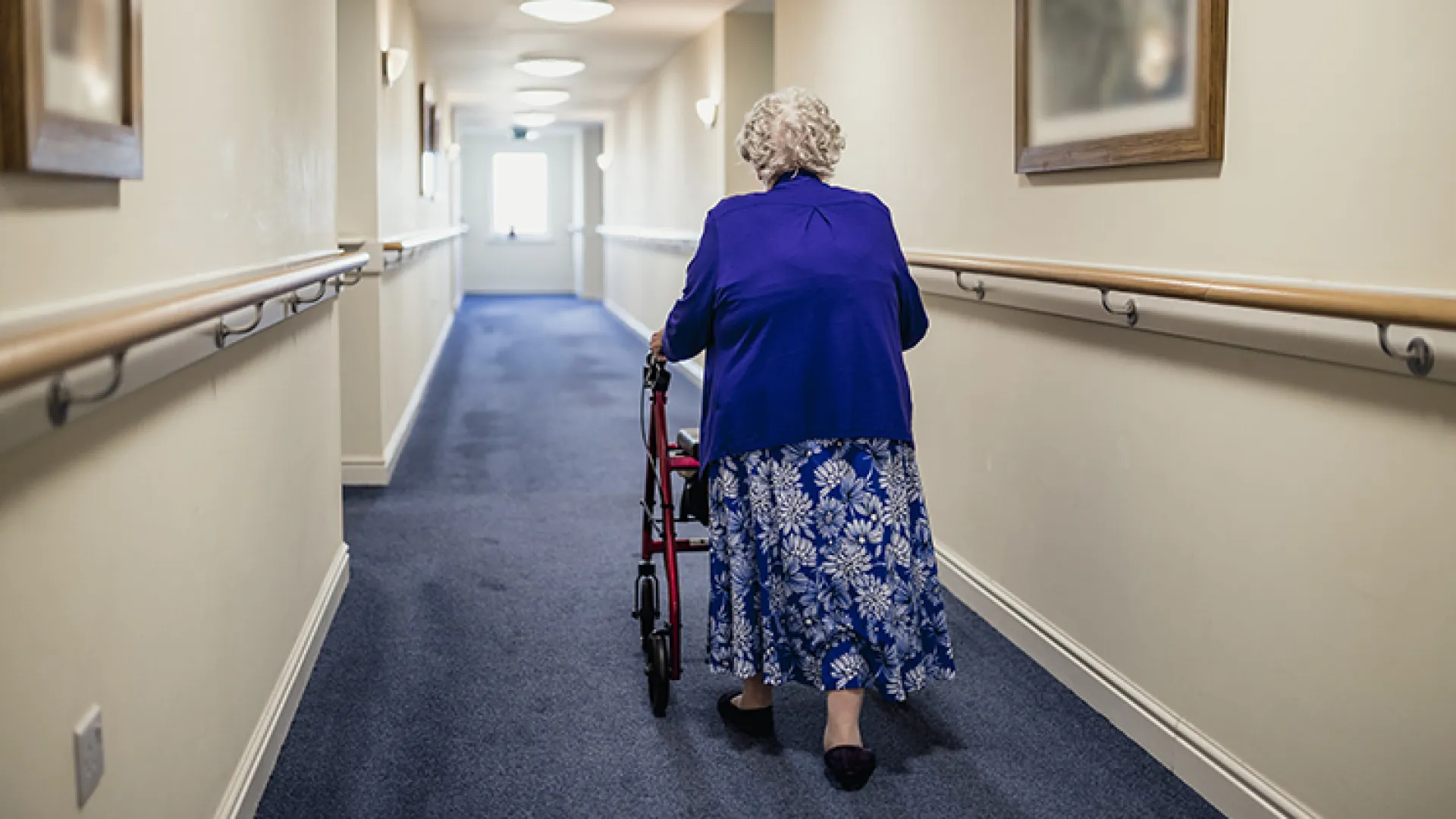 Woman with walker in nursing home