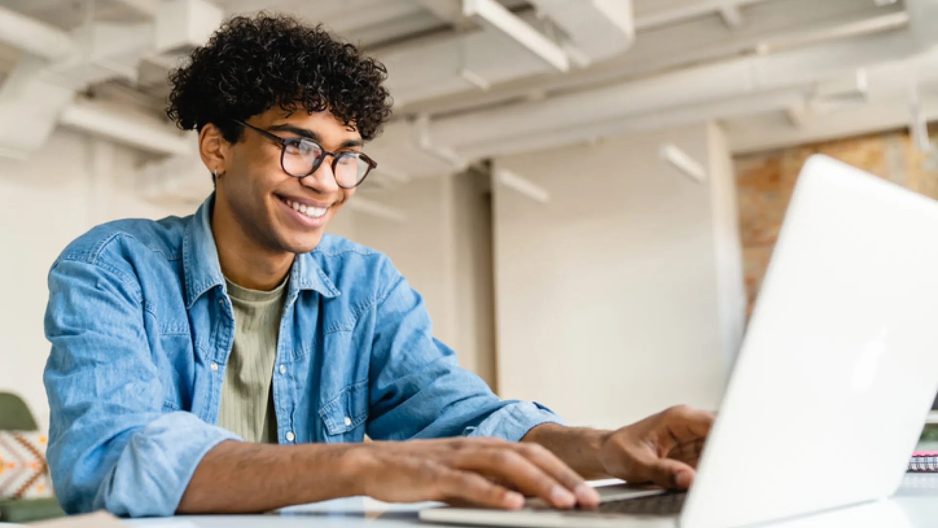 Young businessman at laptop