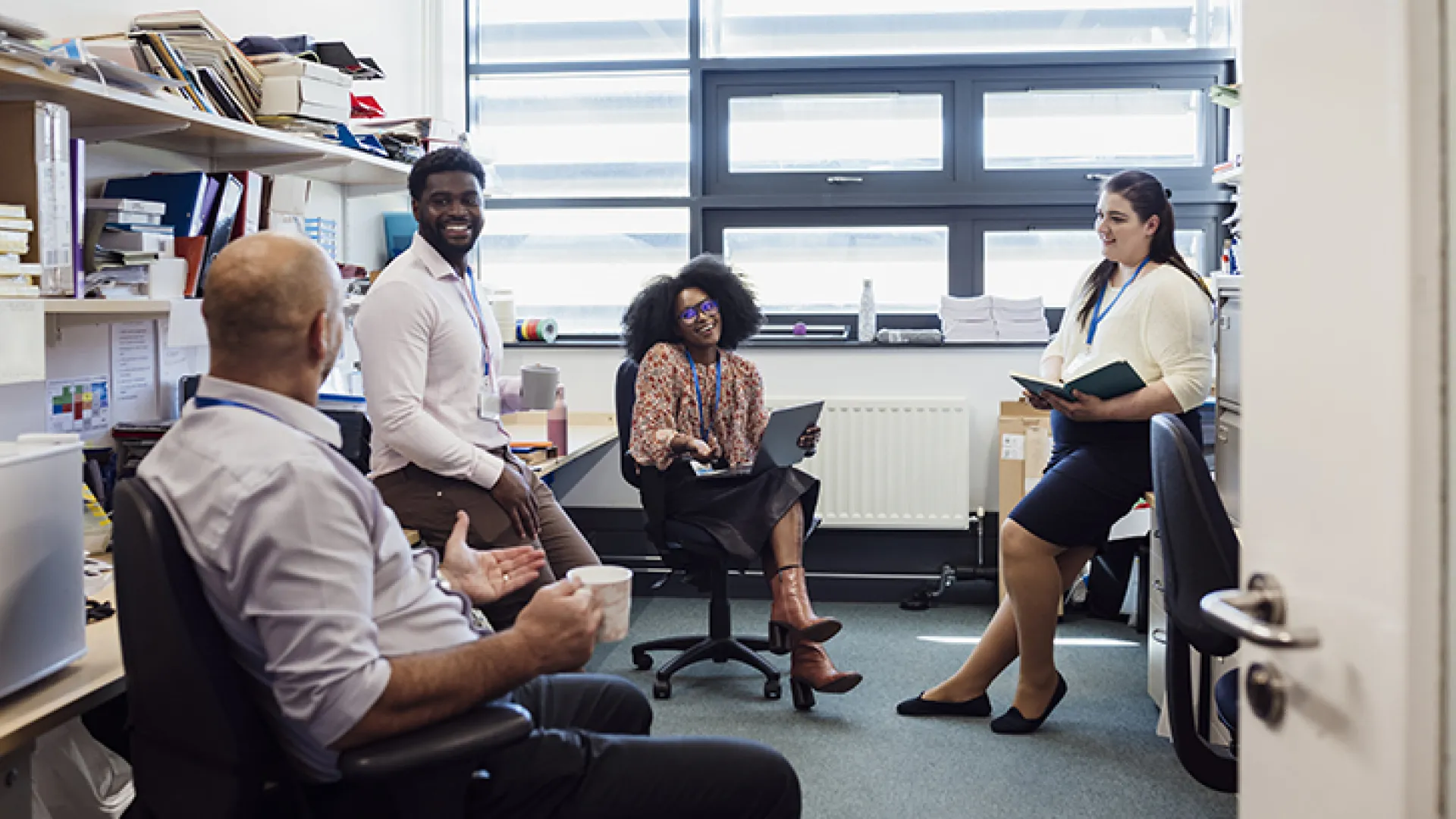 Group of colleagues talking in office