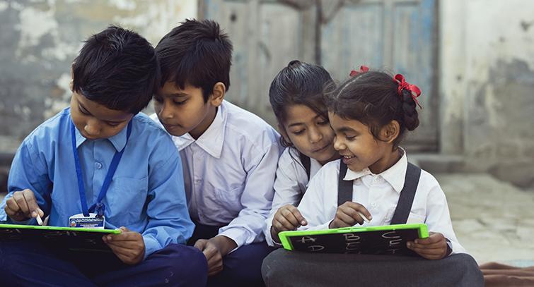 Indian schoolchildren writing on slates