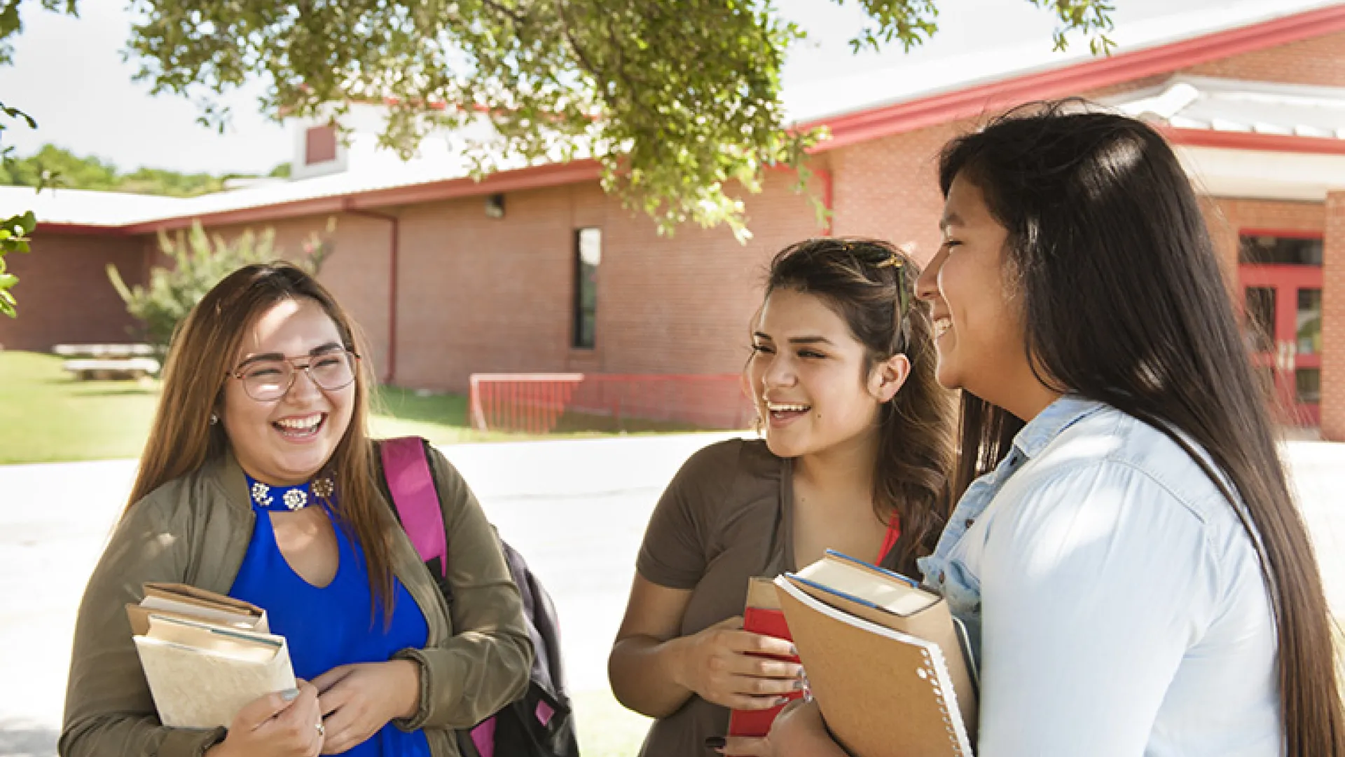 Native American students talking on campus