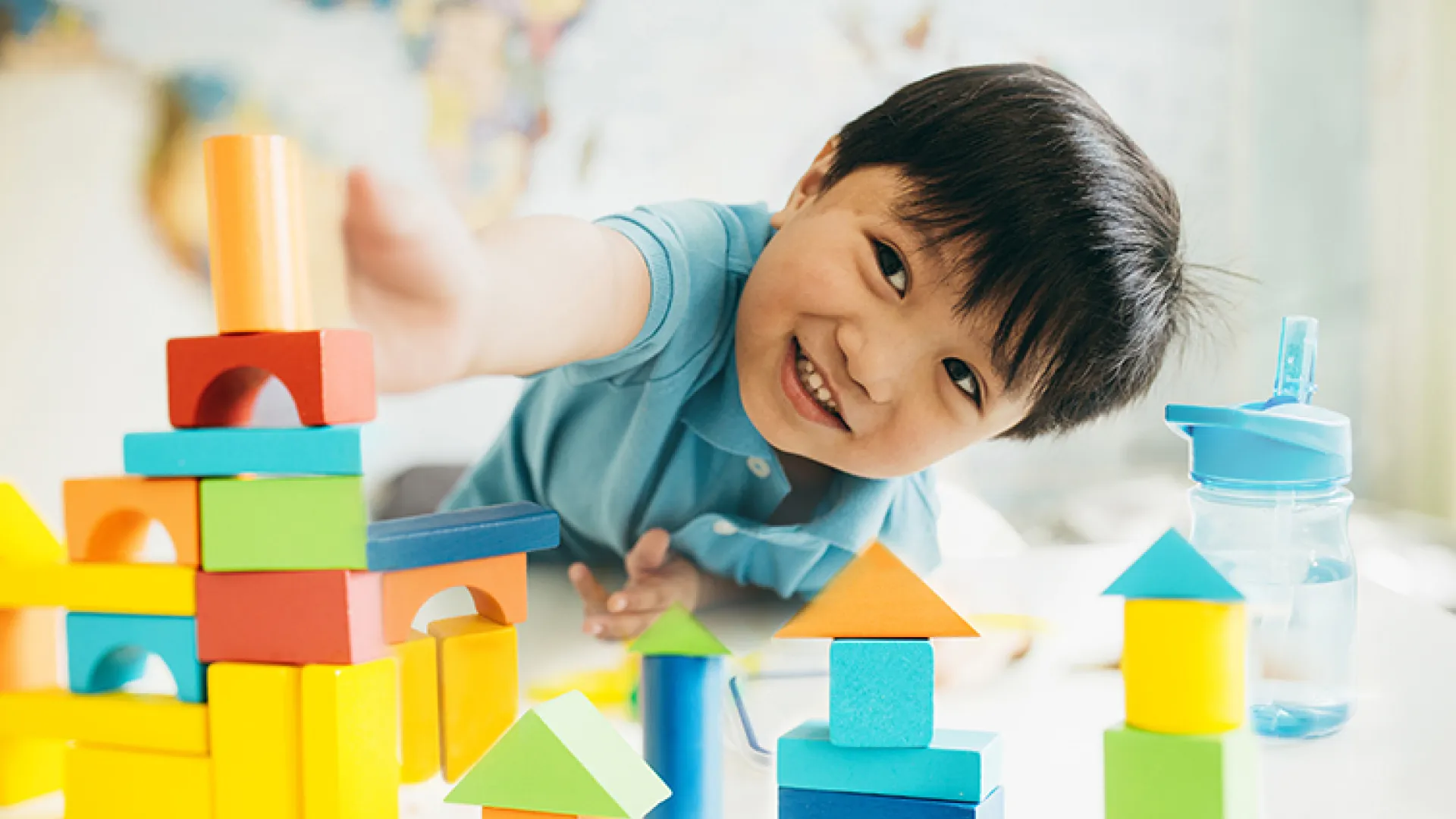 Preschool boy playing with blocks