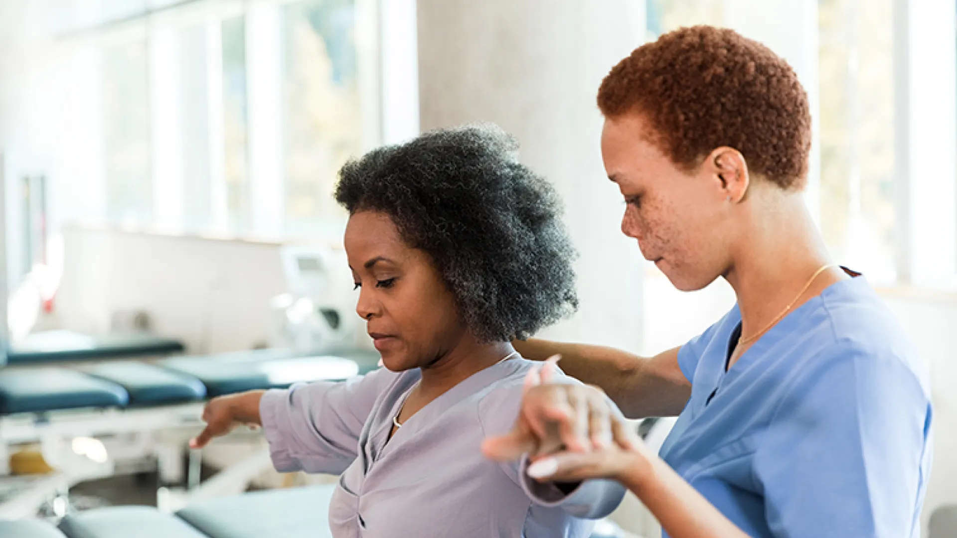 Woman working with her physical therapist