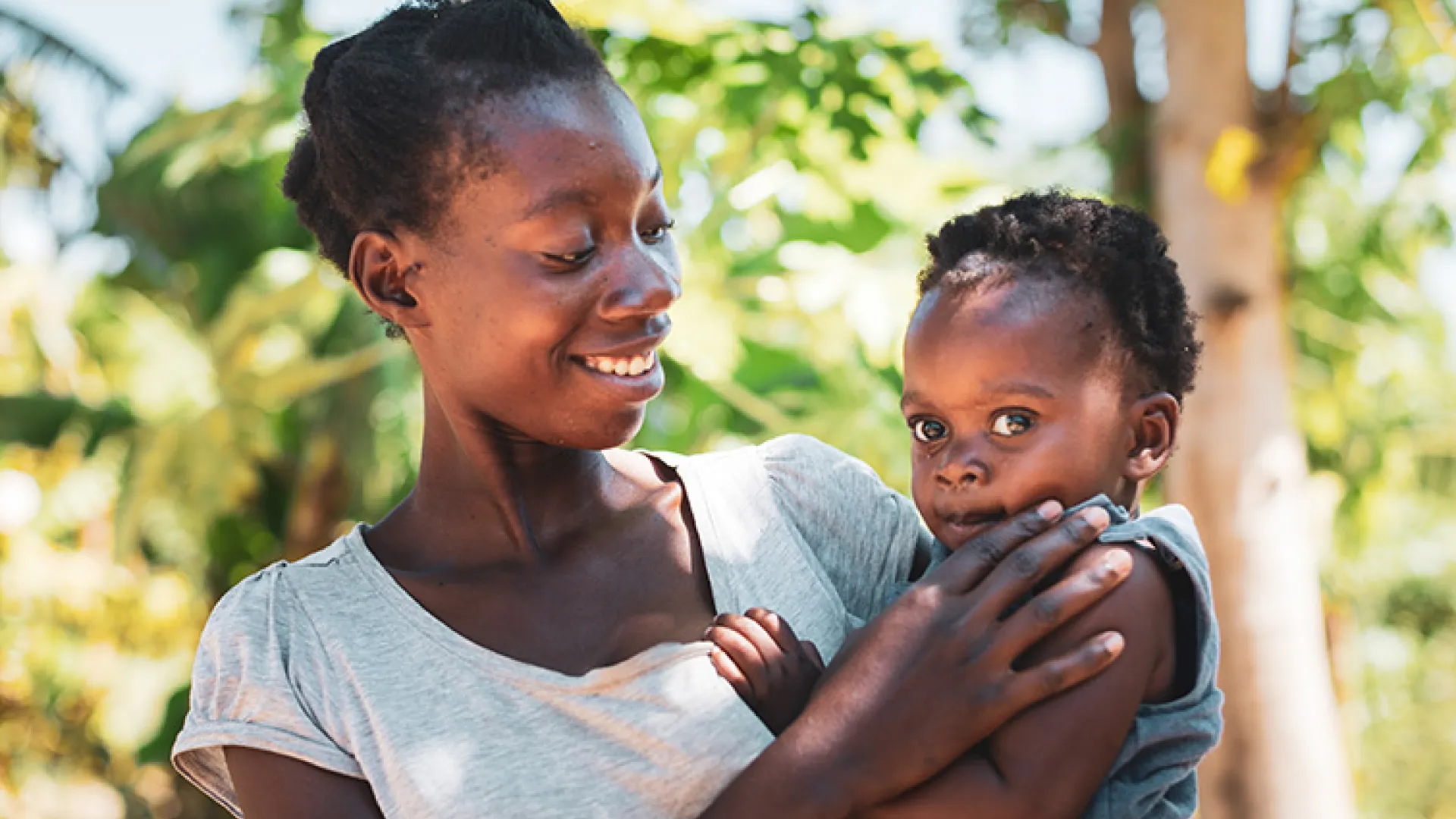 African mother holding her toddler