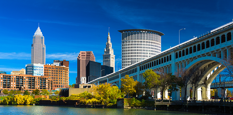 Downtown Cleveland with River, Bridge, Trees, and Deep Blue Sky 