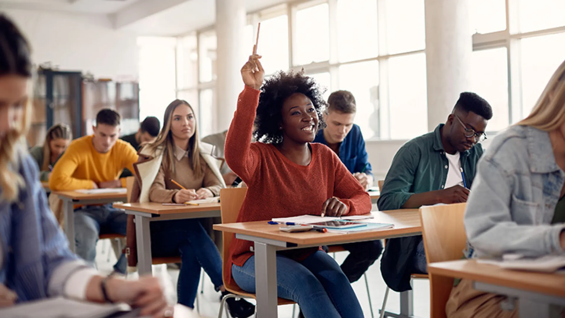 Young adult students in class