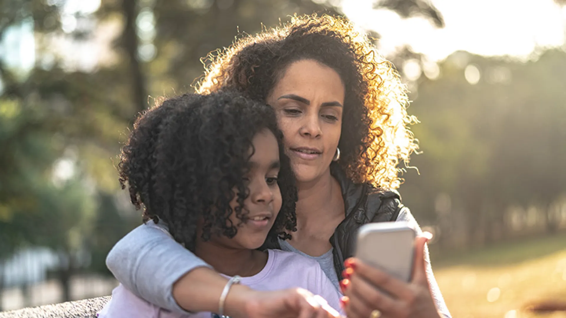 Mom and daughter on smartphone