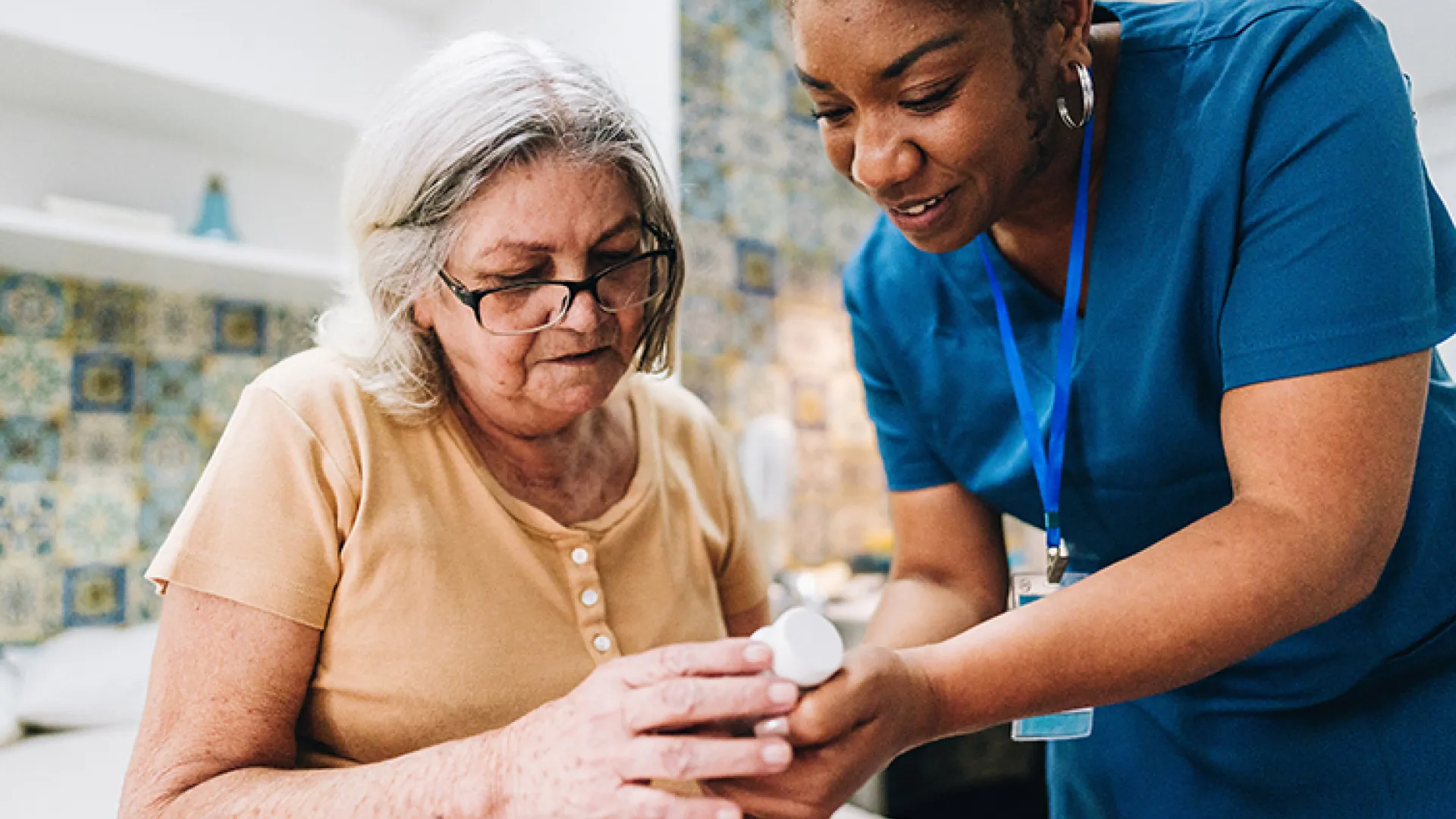 Healthcare worker with older patient