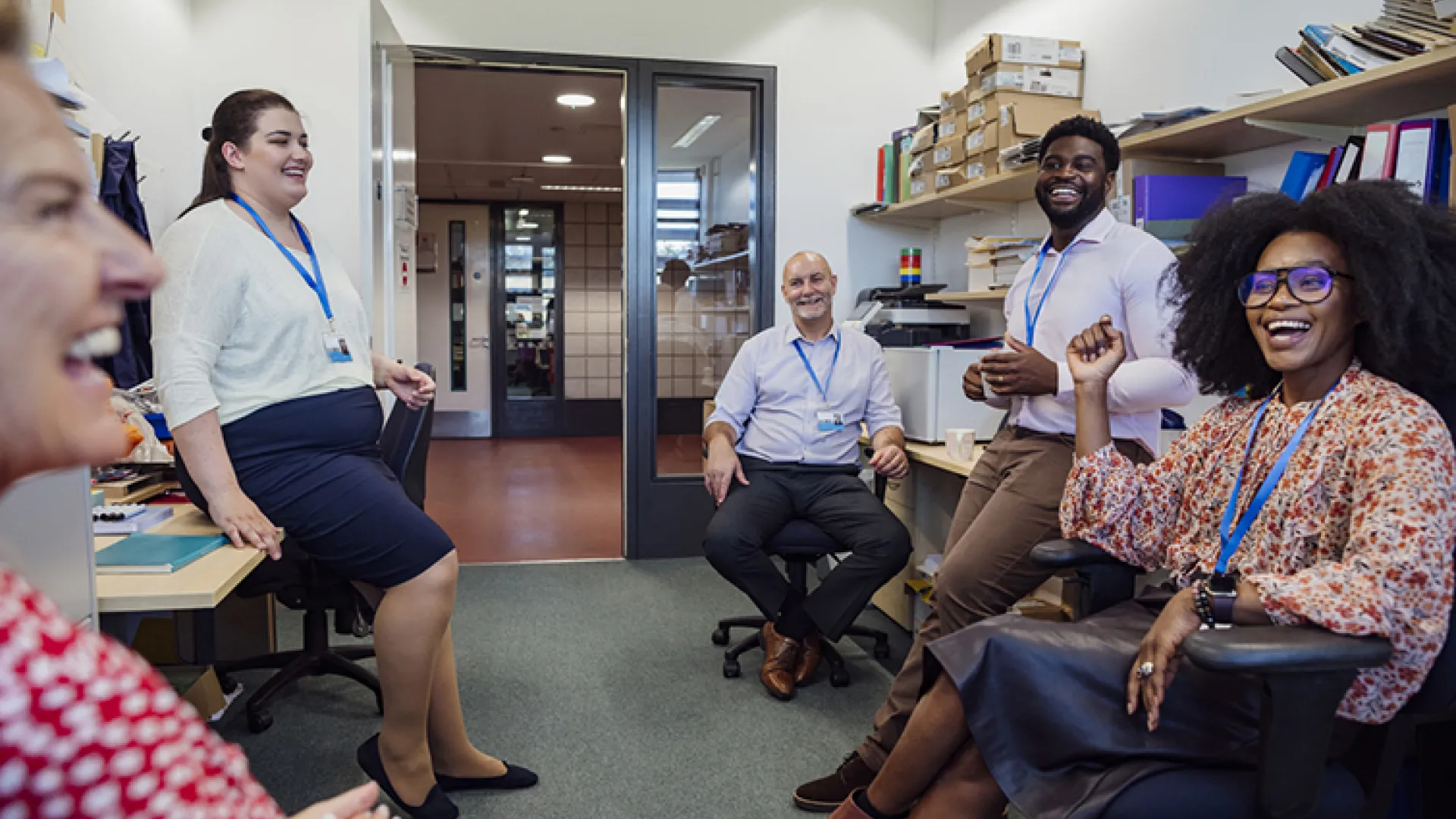 group of teachers laughing together