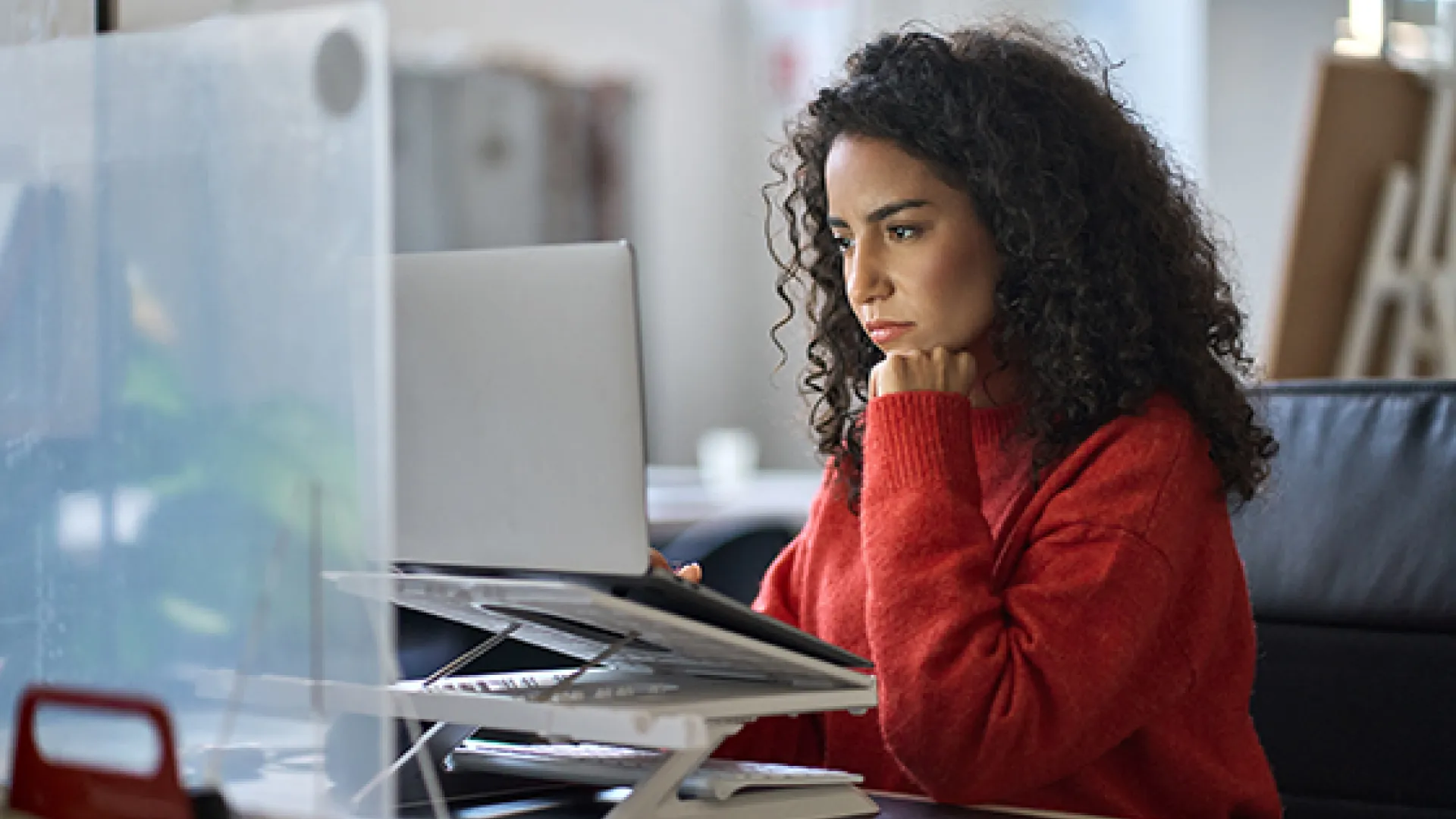 Woman at computer looking serious