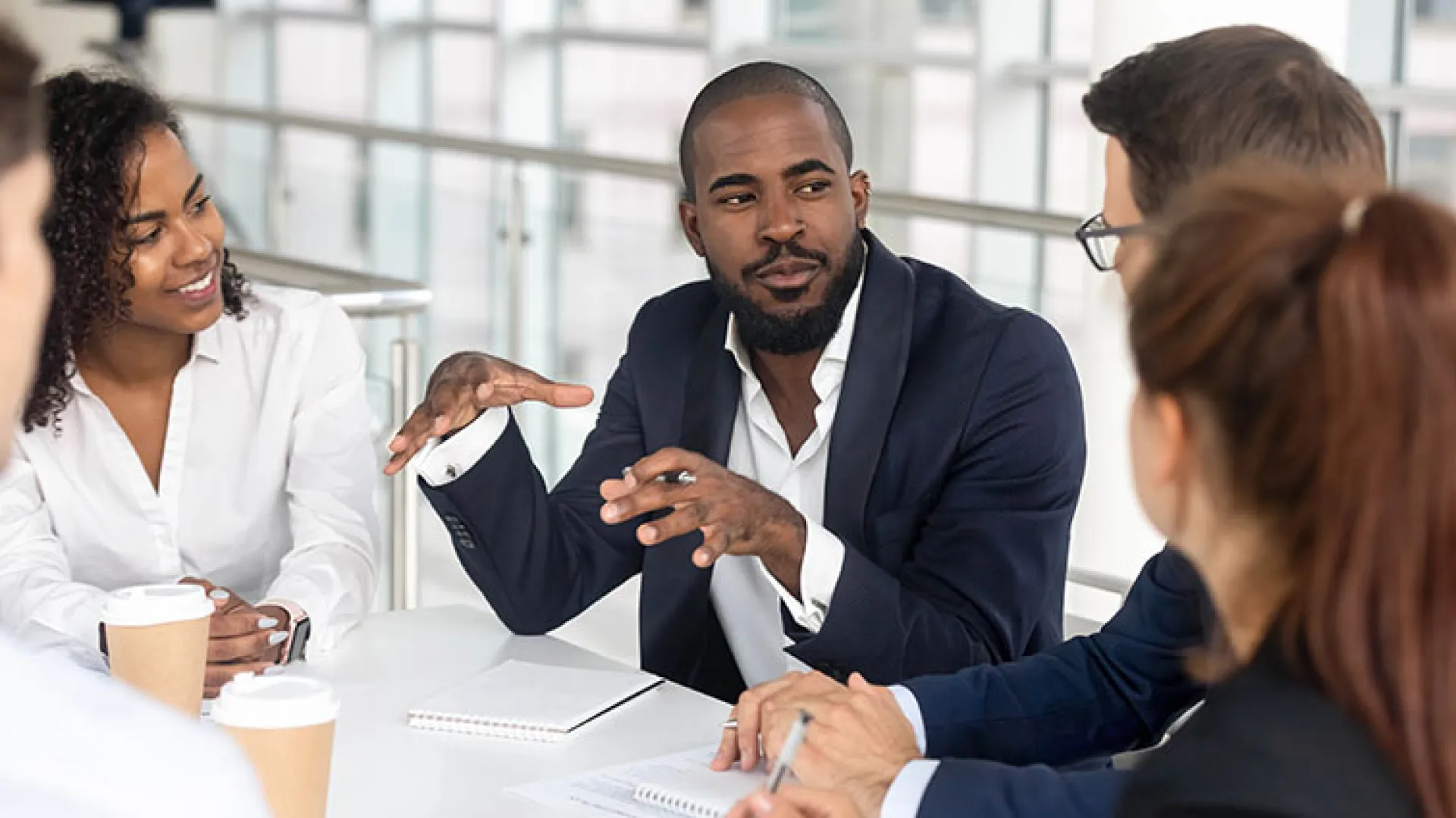 African American man leading a meeting