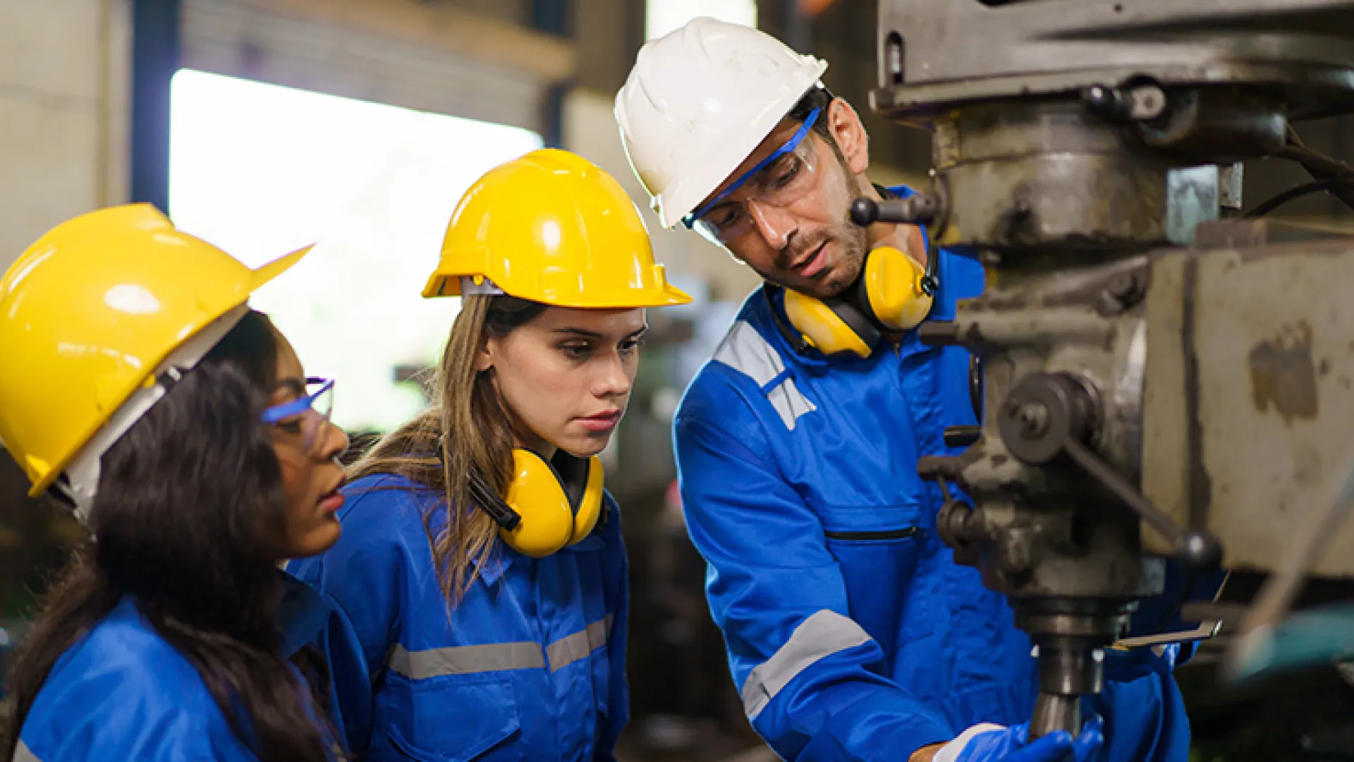 Factory worker with apprentices