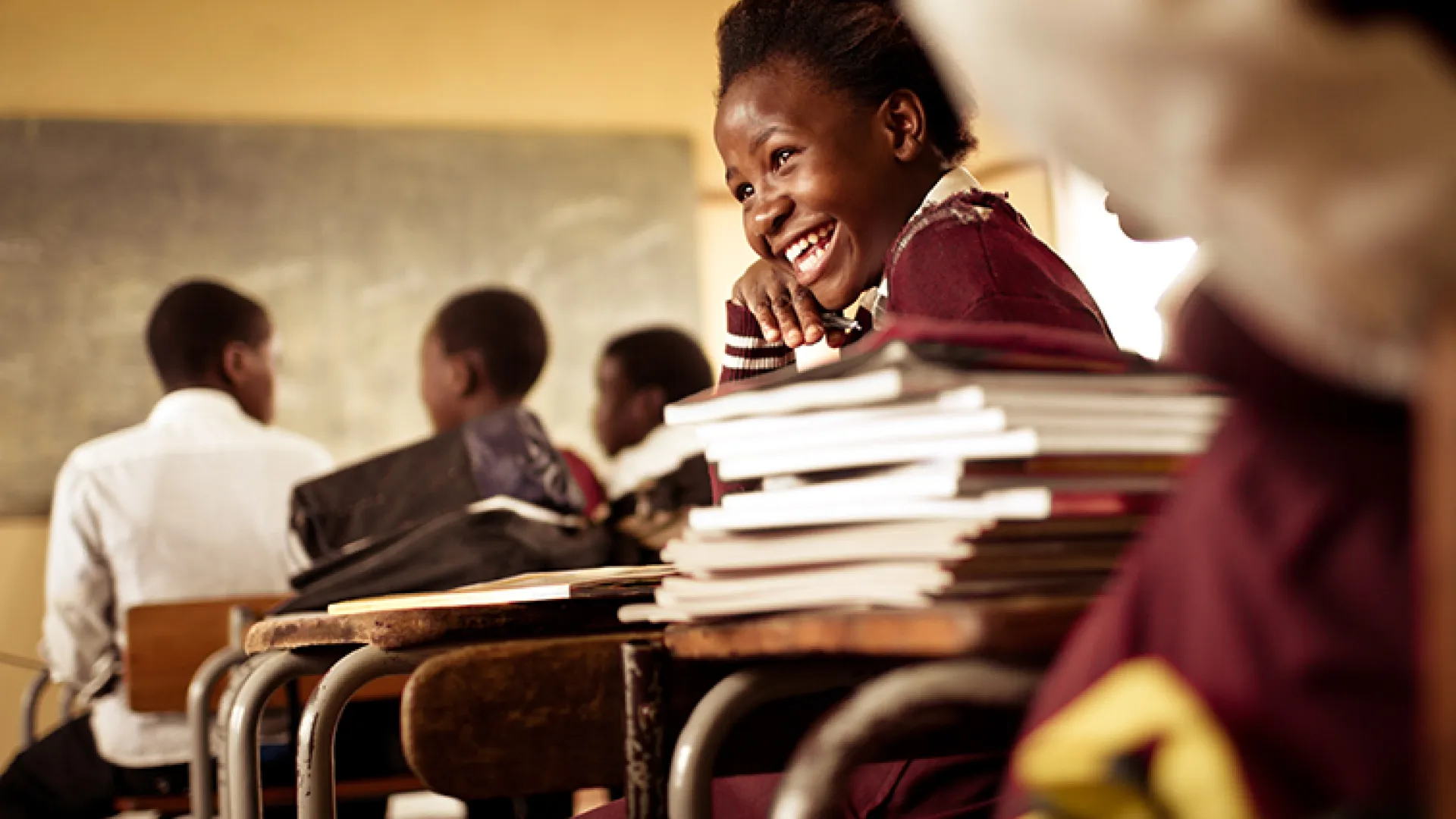 young african girl laughing in class