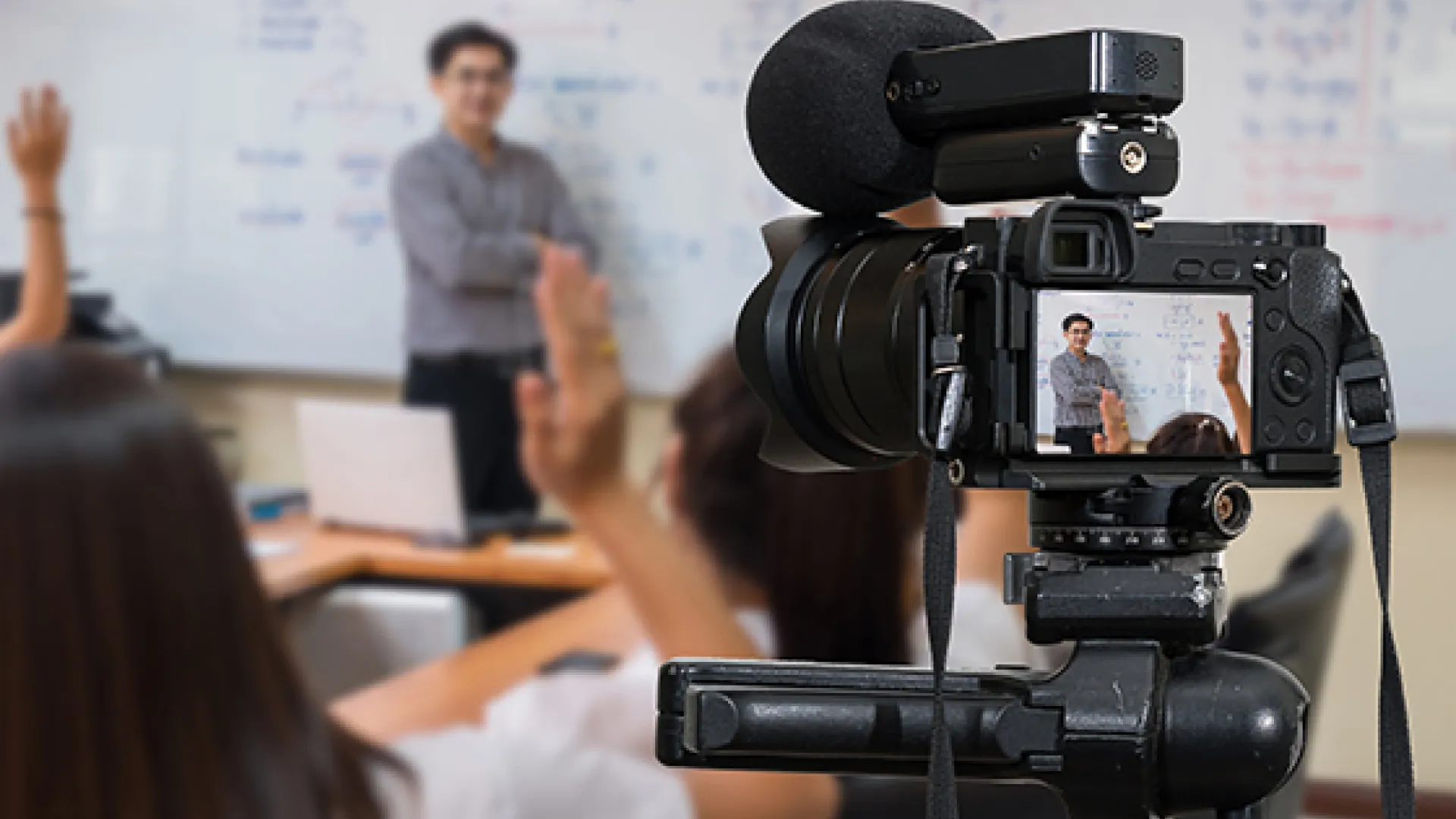 Video camera filming a teacher
