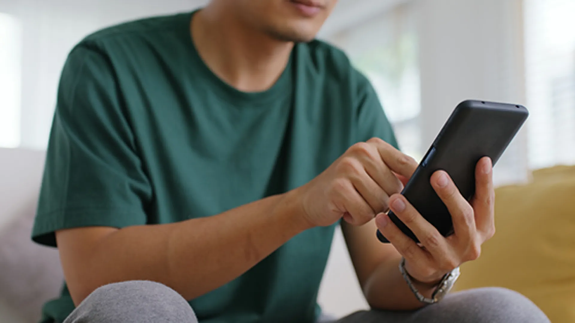 Parent looking at cell phone