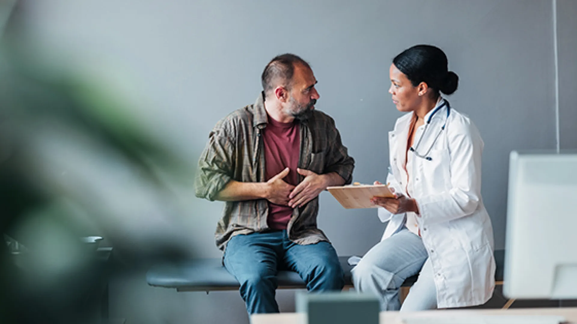 Patient and caregiver in clinic setting