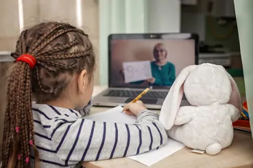 Image of young girl learning at her laptop