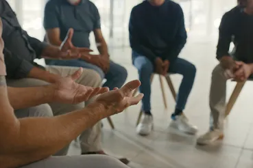 Man in a group therapy meeting