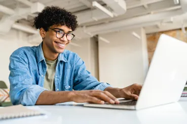 Young businessman at laptop