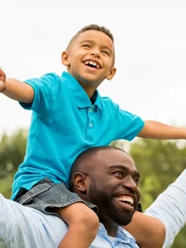 Father with son on shoulders