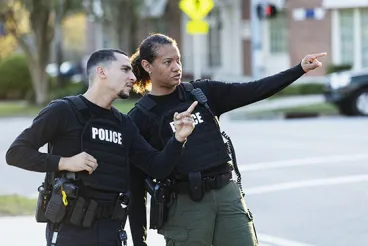 Two police officers working together