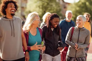 Group of multiracial friends laughing outside