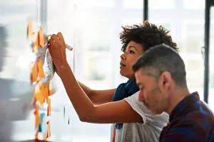 Researchers at whiteboard