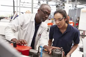 Employer and apprentice in factory