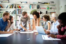 Staff meeting at conference table