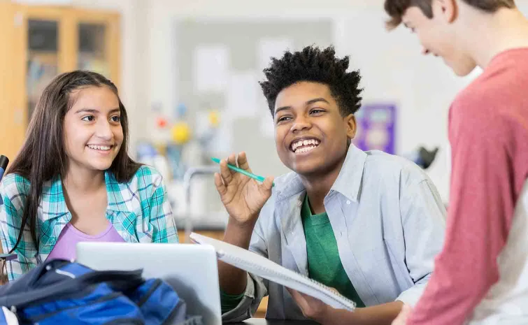 High school students laughing together in class