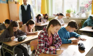Students taking an exam in classroom