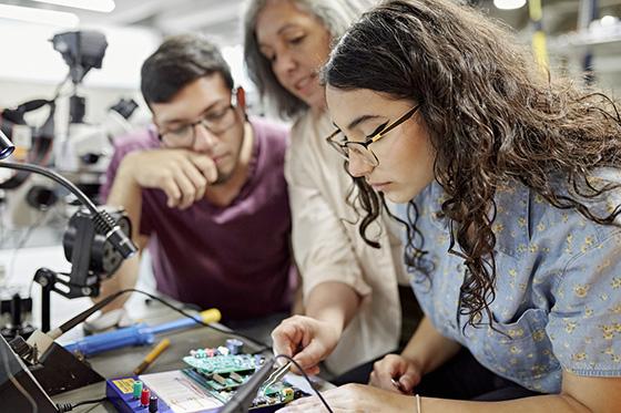 Instructor assisting electrical engineering students