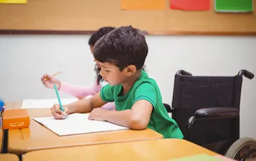 Image: Boy in wheelchair at desk