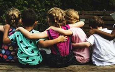 Young children arm in arm